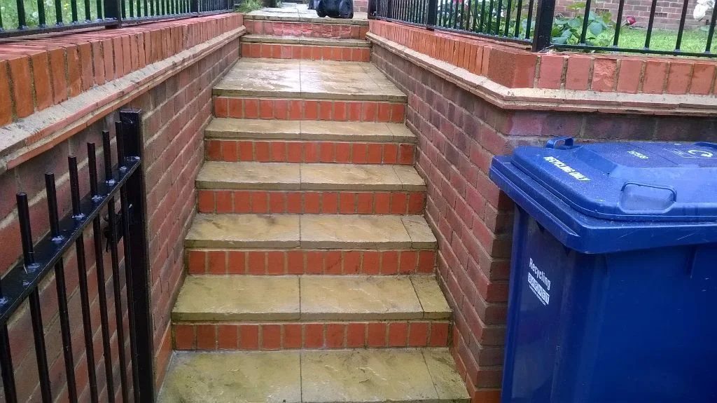 Brick front steps and railings cleaned down